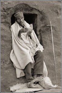 photograph of desert monk with plated prayer rope
